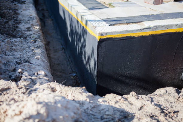 Professional Waterproofing technician working in West Newton, IN
